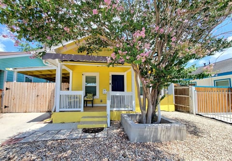 Welcome to your vibrant, sun-drenched home away from home! This cheerful yellow cottage combines historic character with modern comforts to offer a warm, memorable stay.