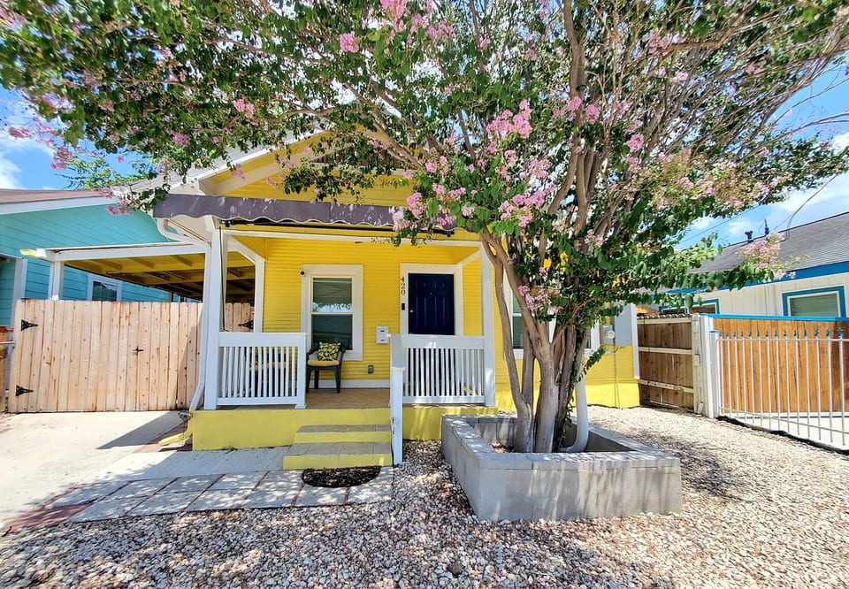 Welcome to your vibrant, sun-drenched home away from home! This cheerful yellow cottage combines historic character with modern comforts to offer a warm, memorable stay.