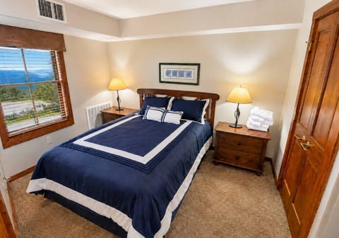 Queen bed in bedroom