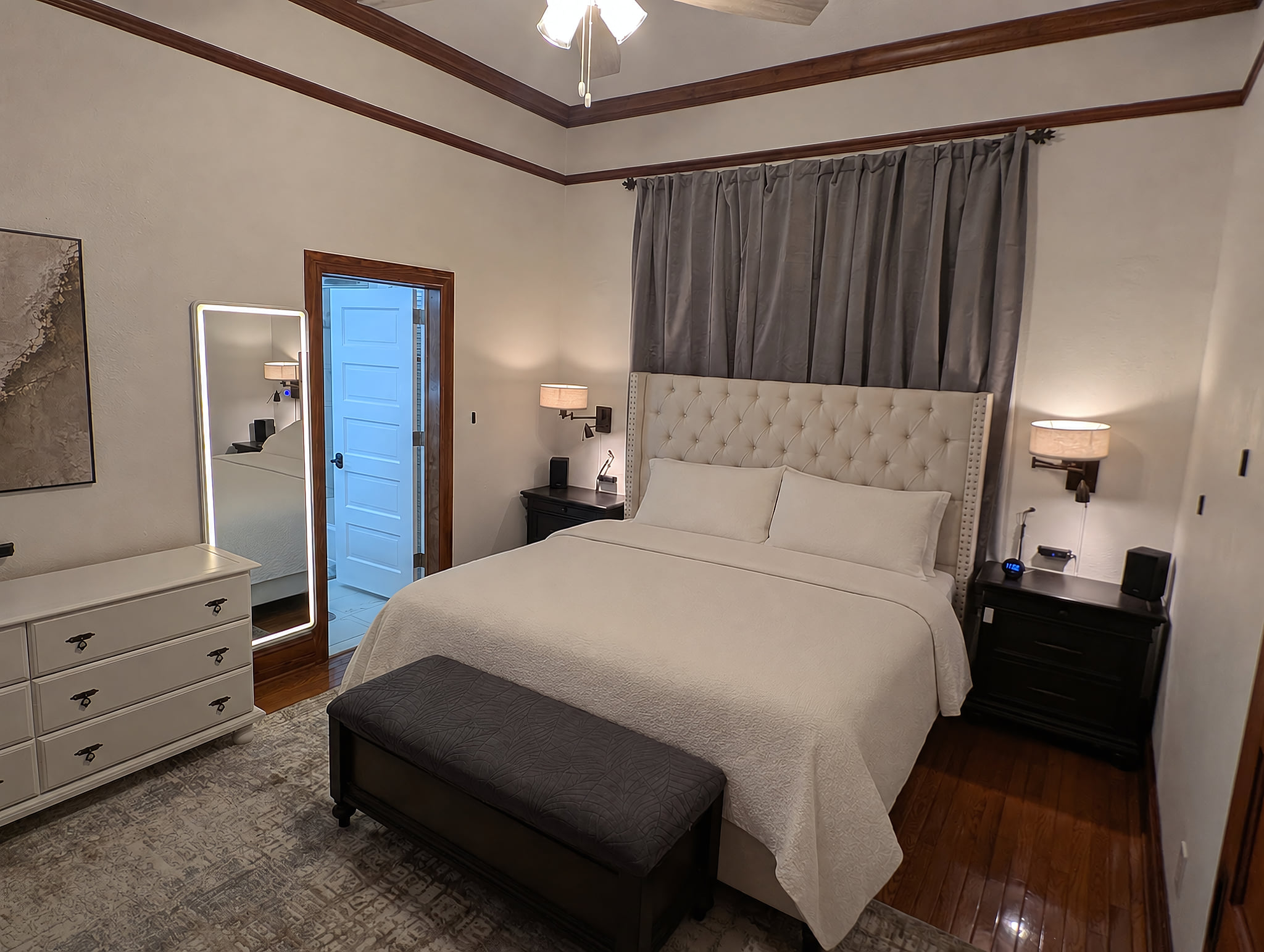 Premier Suite with King bed, front lit mirror, dimming lights.