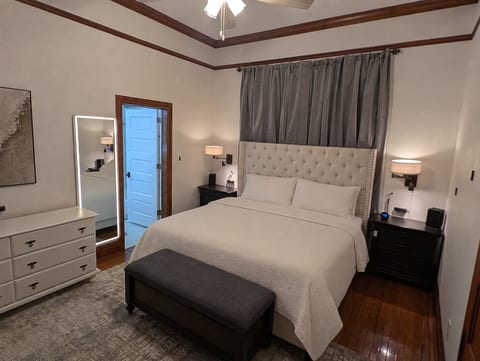 Premier Suite with King bed, front lit mirror, dimming lights.