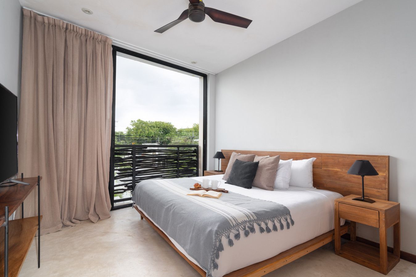 This inviting room features a luxurious king bed, large windows with gorgeous views, and plenty of sunlight. Designed for comfort and relaxation, it’s the perfect retreat to rest and recharge.