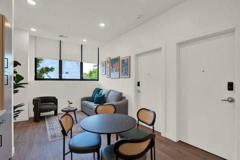 Bright modern lounge with dining space and cozy seating