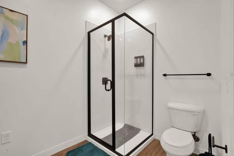Modern bathroom with sleek glass shower and stylish black accents