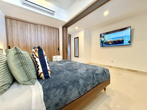 King-size bed with last model TV