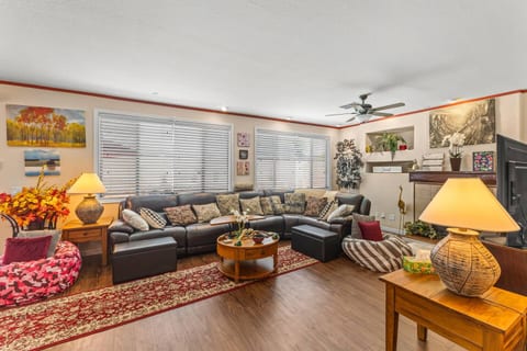Cozy, spacious living room with large sectional and warm natural light
