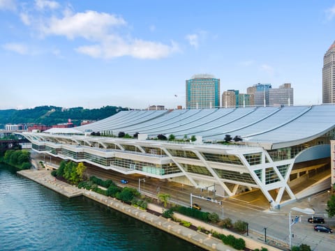 Iconic waterfront city views beside a stunning modern convention center