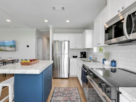The heart of the home, this beautiful kitchen offers everything you need to prepare meals, snacks, and beach-day picnics with ease.