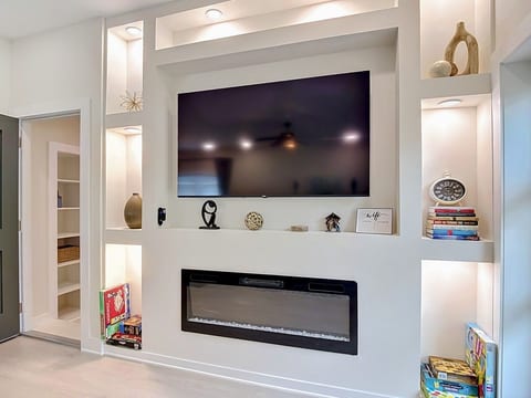 8103 N Klondyke Street-13Custom built ins w/ fireplace and games