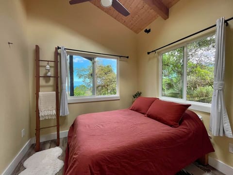 Cozy bedroom with full sized bed and more views.