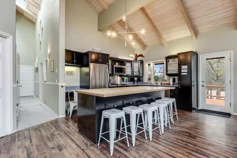 Spacious vaulted kitchen with large island seating for six