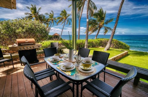 Beautiful oceanfront/beachfront home on large lot with huge lanai with large dining and seating area. Enjoy meals with friends and family at sunset.
