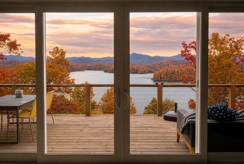 The best seat in the house. ☕🏔️ Wake up to sweeping views of Lake Santeetlah and the Smoky Mountains from the comfort of Hidden Point House.