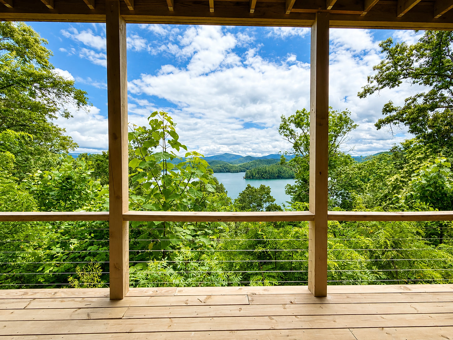 A view worth slowing down for.
Take in sweeping views of Lake Santeetlah and the surrounding mountains from the spacious deck at Hidden Point House.
