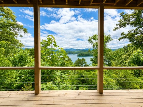 A view worth slowing down for.
Take in sweeping views of Lake Santeetlah and the surrounding mountains from the spacious deck at Hidden Point House.