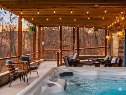 Relax in the hot tub while enjoying the scenic views.