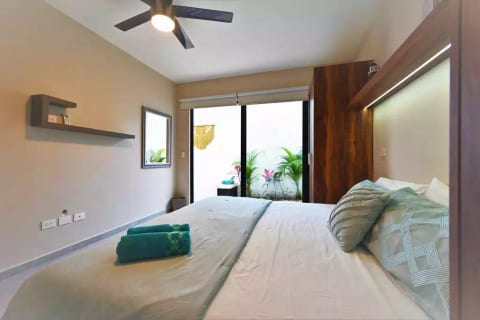 Ceiling fan and light to read for your bedroom, with a beautiful view of your private garden and pool