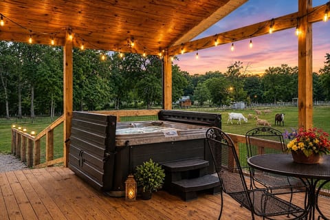 Soak in the hot tub while overlooking the animals grazing in the pasture