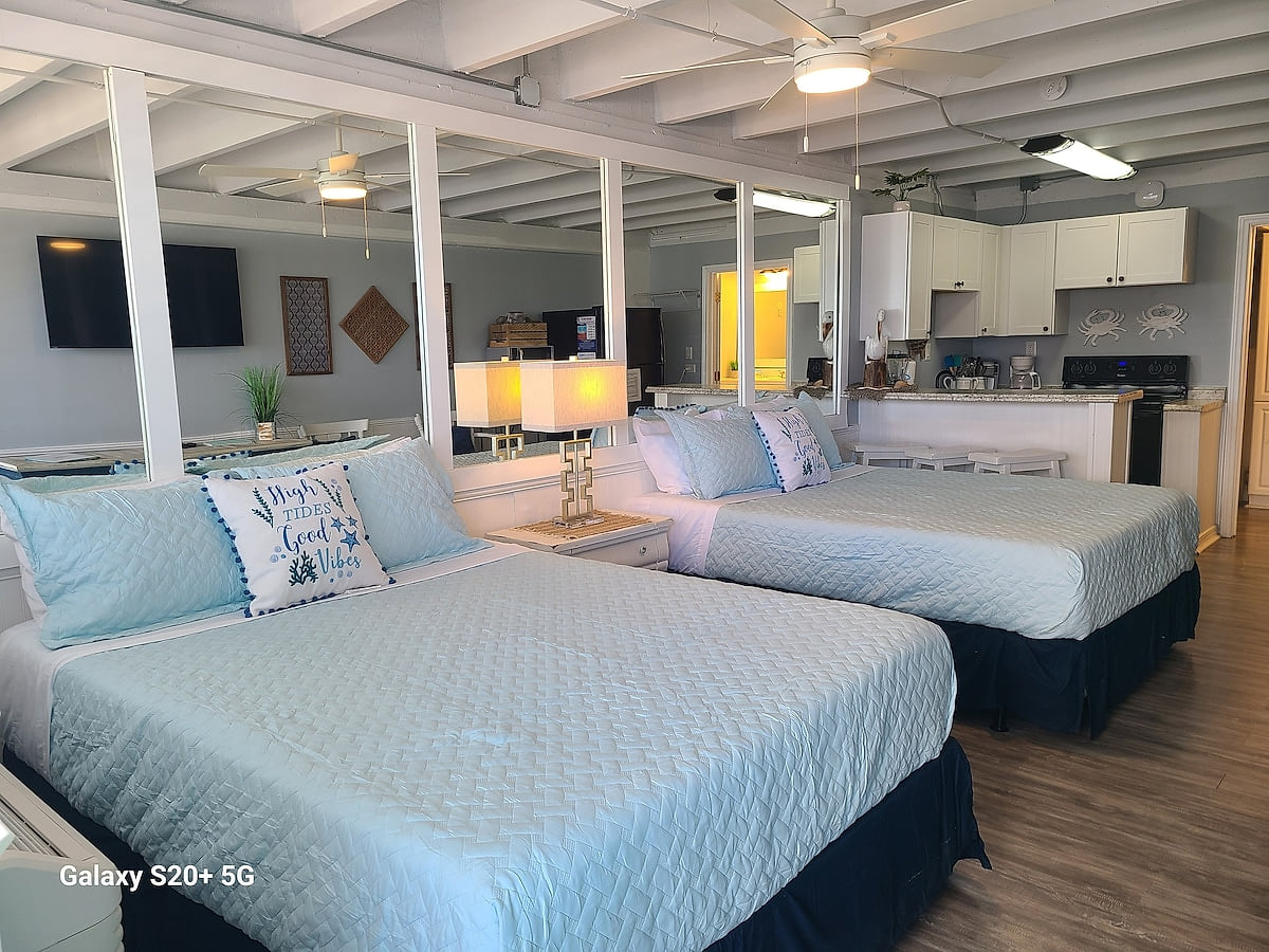 Cozy sleeping area with two comfy queen beds and fresh linens.
