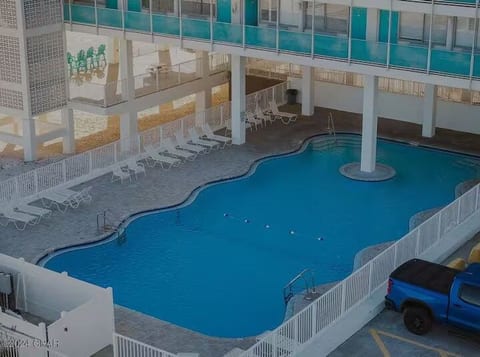 Beachfront pool and sundeck just steps from the white sand.
