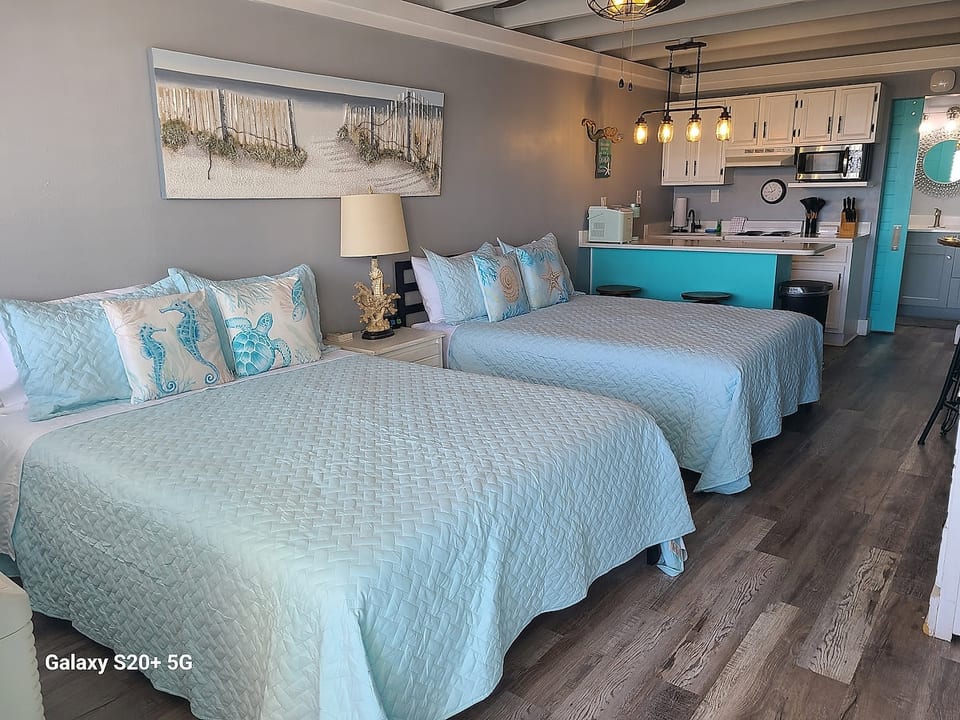 Cozy sleeping area with two queen beds and plenty of space to unwind.