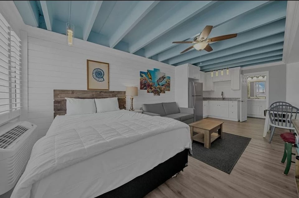 Queen bed and sleeper sofa for flexible sleeping arrangements.