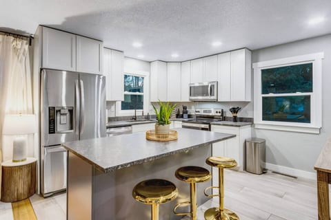 Full-size appliances and counter space, so cooking for nine never feels cramped.