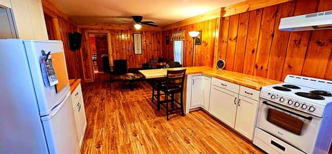 Fully equipped kitchen with dining island, modern appliances, and plenty of space for cooking and gathering.