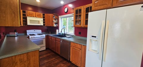 Fully equipped kitchen with spacious countertops, full-size appliances, and plenty of cabinet storage.