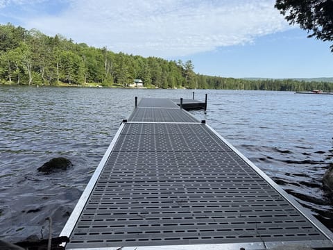 Private dock with direct lake access, perfect for swimming, fishing, boating, and enjoying waterfront views.