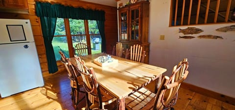 Rustic dining area with handcrafted wood table and seating.