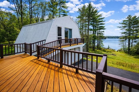 Spacious lakeview deck overlooking the water, perfect for morning coffee, outdoor dining, and relaxing in a peaceful setting.
