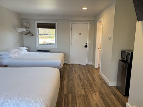 Two queen beds, a flat-screen TV, microwave, a comfortable and convenient stay.