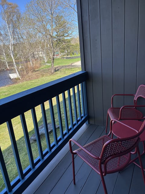 Private balcony with comfortable seating, perfect for relaxing and enjoying the fresh air.