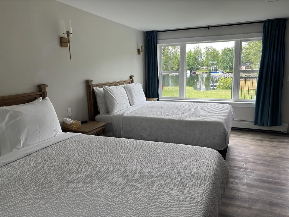 Spacious room with two cozy queen bedsβperfect for families or friends.