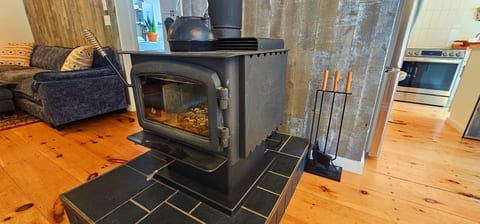 Cozy wood stove for warm and relaxing cabin evenings.