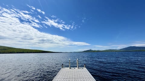 Enjoy easy waterfront access from this private 20-foot dock, perfect for boats up to 18 feet and relaxing days on the water.