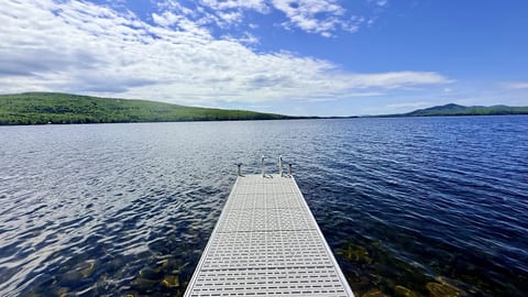 Enjoy easy waterfront access from this private 20-foot dock, perfect for boats up to 18 feet and relaxing days on the water.