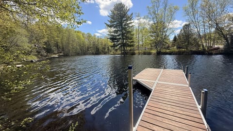 Private 20-foot waterfront dock with space for boats up to 18 feet, making it easy to enjoy boating, fishing, and relaxing on the lake.