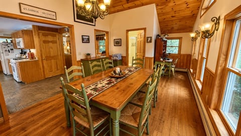 Gather around the large dining table, perfect for family meals, game nights, and spending time together.