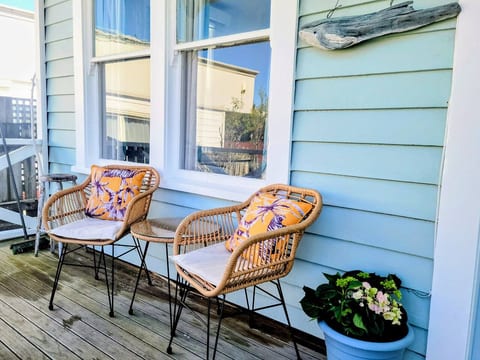 Enjoy your morning coffee on the front porch admiring the historic buildings of Hokitika across the road.