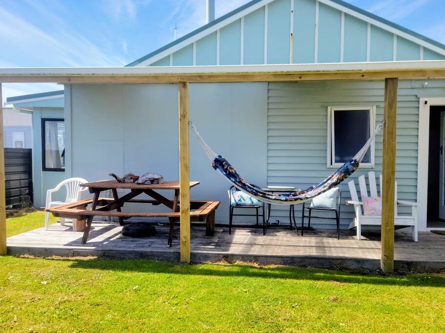 Relax in the backyard under the veranda. 