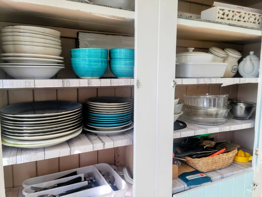 The kitchen has plenty of plates, serving dishes and utensils in case you need to cook. But there are so many food choices within a short walk - you really don't need to!