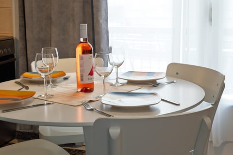 Bright dining nook with a fully set table for relaxed meals and wine