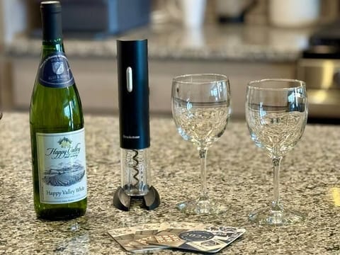Wine-ready kitchen setup with elegant glasses and thoughtful amenities