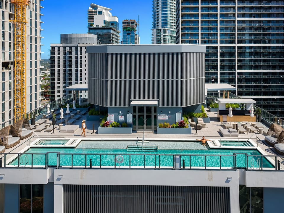 Aerial view of the rooftop pool & building exterior 🏙️