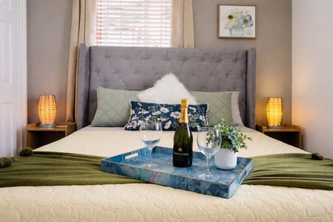Turn every night into a special experience: This cozy bedroom is designed for pure relaxation, featuring a plush headboard and soft bedding that wraps you in comfort.  The perfect space to unwind and enjoy.