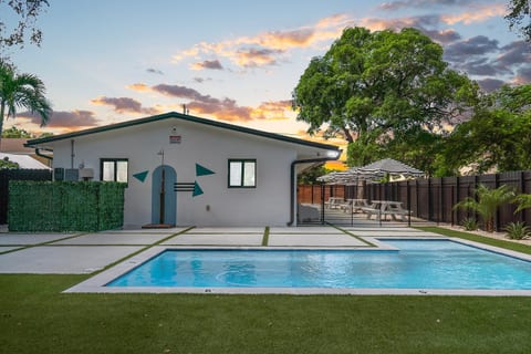 Outdoor Oasis: Dive into relaxation by the pool and enjoy stunning Miami sunsets!