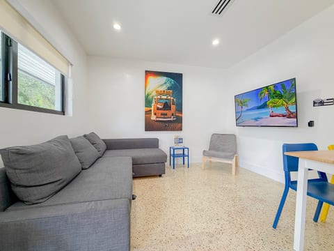 Living Room: Bright space with fun decor, plush seating, and a perfect spot for movie nights!
