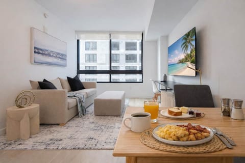 Bright living room with modern décor—perfect for breakfast with a view or relaxing!